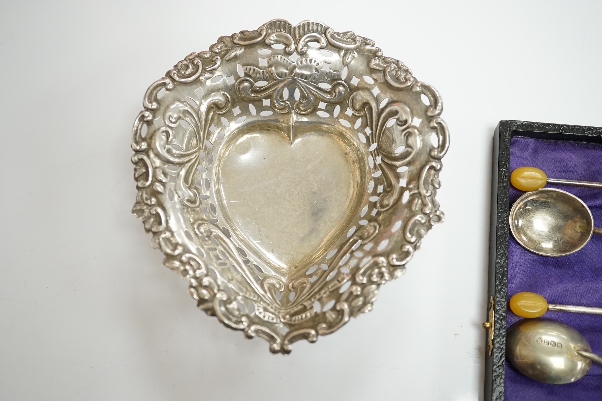 An Elizabeth II silver quatrefoil dish by James Dixon & Sons, Sheffield, 1967, 14.2cm, together with a silver spoon and pusher, silver bonbon dish, pair of silver wishbone nips and a cased set of plated spoons. Condition